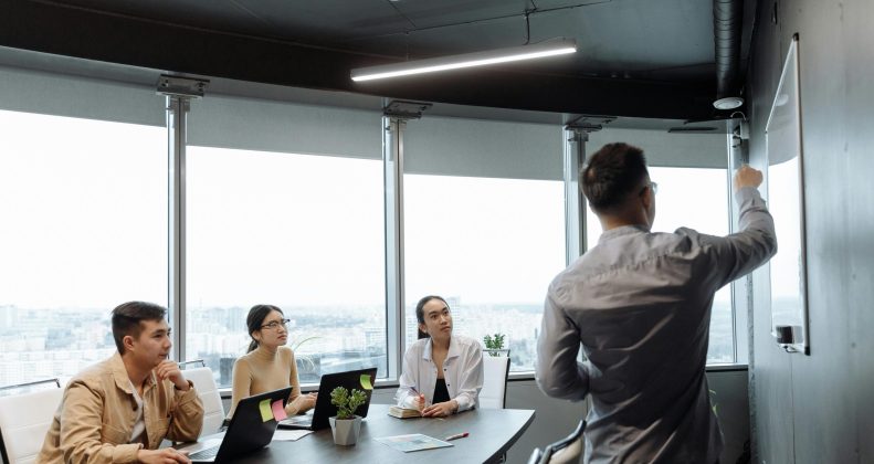 Feature graphic showing HR professionals using digital tools, data analytics, and automation to redefine human resources.